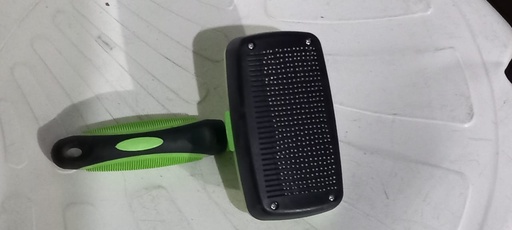 Dog grooming brush retractable front view